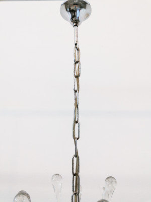 Lampadario a sospensione attribuito alla mano di Paolo VENINI in vetro soffiato di Murano e metallo cromato. Italia, Anni 60