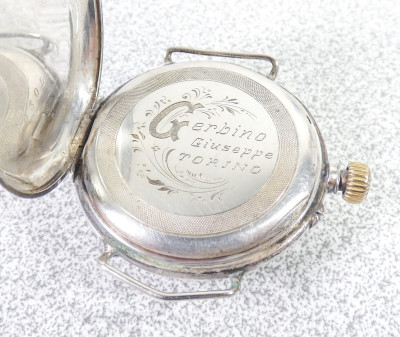 Orologio in argento 800 firmato Giuseppe GERBINO Torino, modello da tasca con anse per il cinturino. Fine Ottocento Primissimo Novecento