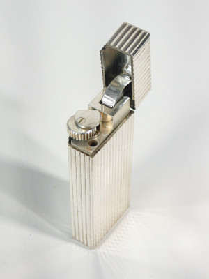 Tris di accendini vintage, due CARTIER e un DUNHILL. Anni 80